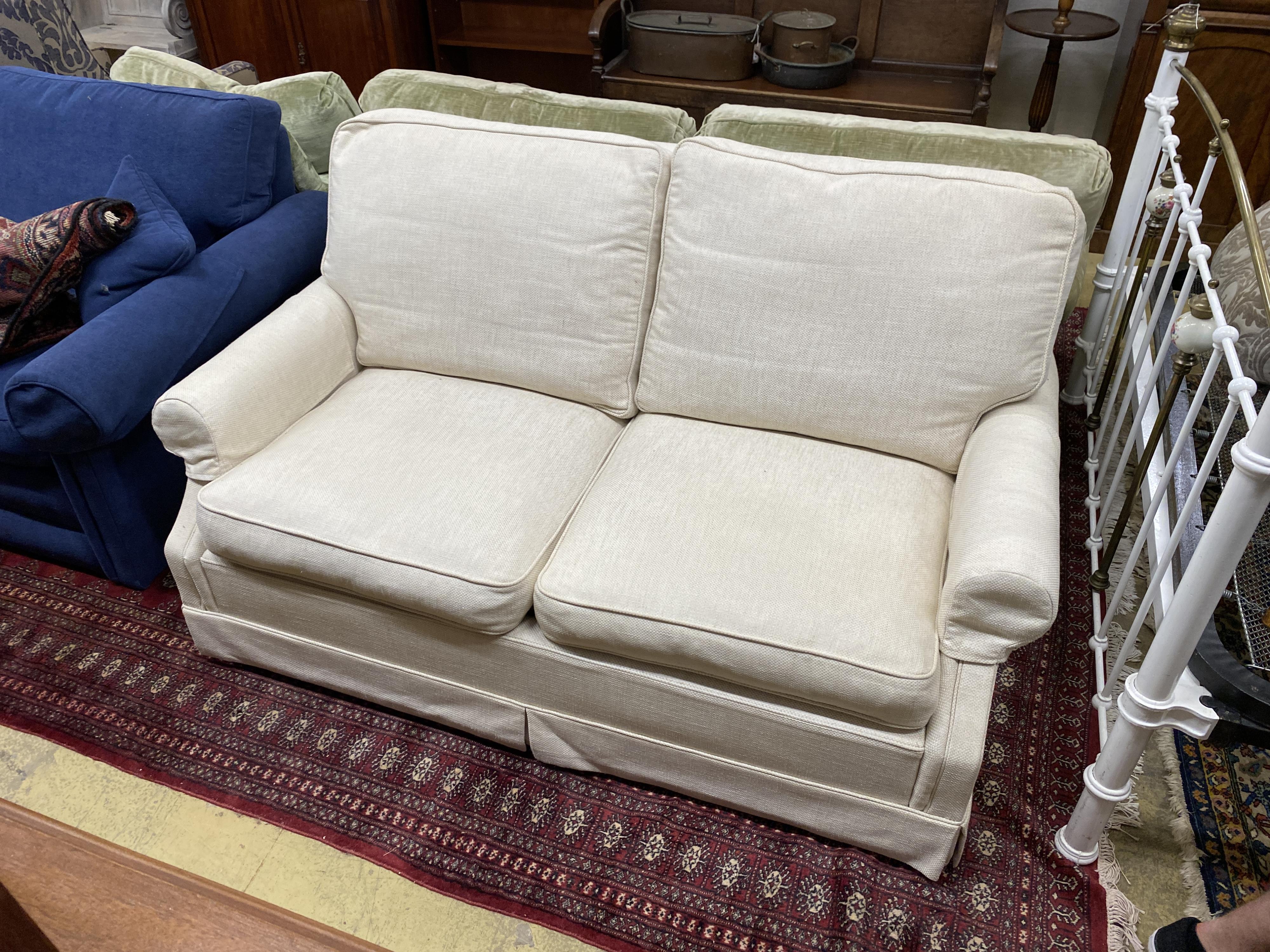 A Wesley Barrell cream fabric metal action two seater sofa bed, width 160cm, depth 96cm, height 82cm